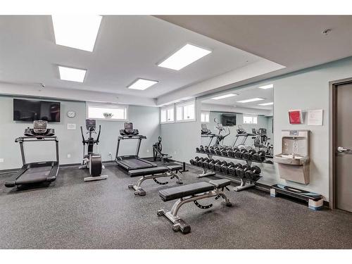 409-15 Cougar Ridge Landing Sw, Calgary, AB - Indoor Photo Showing Gym Room