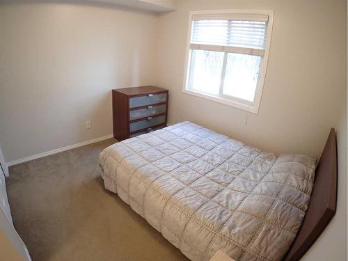 107-6315 Ranchview Drive Nw, Calgary, AB - Indoor Photo Showing Bedroom