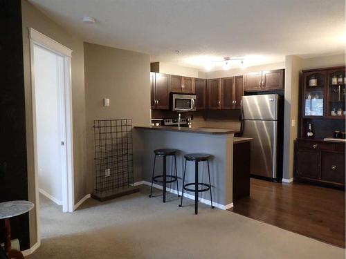 107-6315 Ranchview Drive Nw, Calgary, AB - Indoor Photo Showing Kitchen With Stainless Steel Kitchen