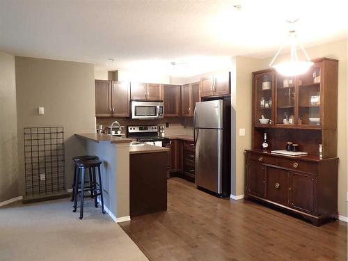 107-6315 Ranchview Drive Nw, Calgary, AB - Indoor Photo Showing Kitchen With Stainless Steel Kitchen