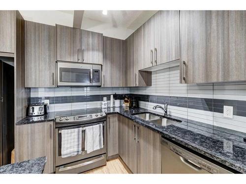 5-4 Sage Hill Terrace Nw, Calgary, AB - Indoor Photo Showing Kitchen With Double Sink With Upgraded Kitchen