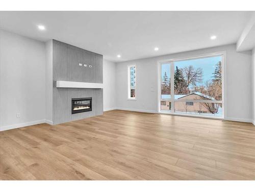 2522 17 Avenue Sw, Calgary, AB - Indoor Photo Showing Living Room With Fireplace