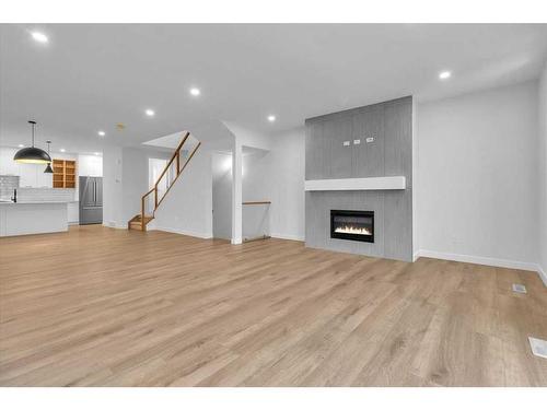 2522 17 Avenue Sw, Calgary, AB - Indoor Photo Showing Living Room With Fireplace