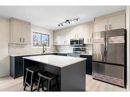 11 Cedarwood Rise Sw, Calgary, AB - Indoor Photo Showing Kitchen With Upgraded Kitchen