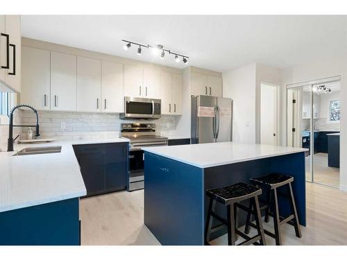 11 Cedarwood Rise Sw, Calgary, AB - Indoor Photo Showing Kitchen With Double Sink With Upgraded Kitchen