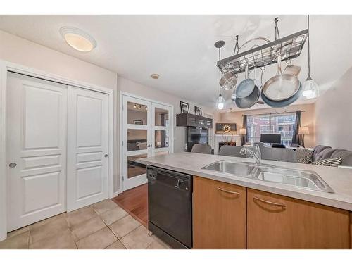 320-5115 Richard Road Sw, Calgary, AB - Indoor Photo Showing Kitchen With Double Sink