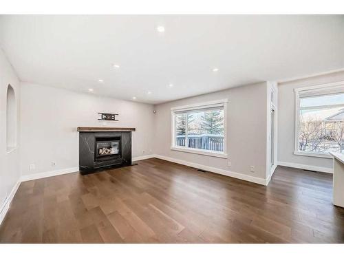 248 Tuscany Ravine View Nw, Calgary, AB - Indoor Photo Showing Living Room With Fireplace