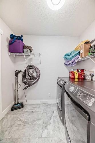 248 Tuscany Ravine View Nw, Calgary, AB - Indoor Photo Showing Laundry Room