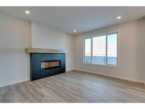 88 Ranchers View East, Okotoks, AB - Indoor Photo Showing Living Room With Fireplace