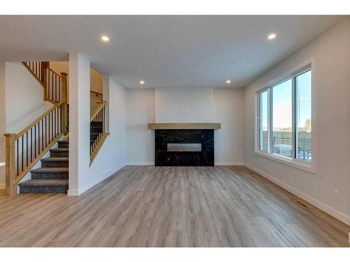 88 Ranchers View East, Okotoks, AB - Indoor Photo Showing Living Room With Fireplace