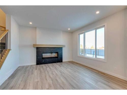 88 Ranchers View East, Okotoks, AB - Indoor Photo Showing Living Room With Fireplace