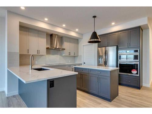 88 Ranchers View East, Okotoks, AB - Indoor Photo Showing Kitchen With Stainless Steel Kitchen With Upgraded Kitchen