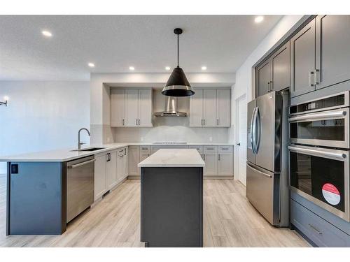 88 Ranchers View East, Okotoks, AB - Indoor Photo Showing Kitchen With Stainless Steel Kitchen With Upgraded Kitchen