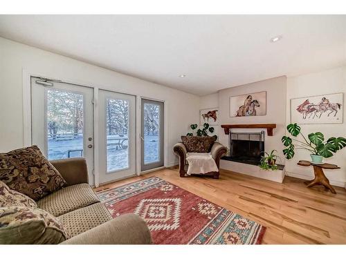 322043 8 Street East, Rural Foothills County, AB - Indoor Photo Showing Living Room With Fireplace