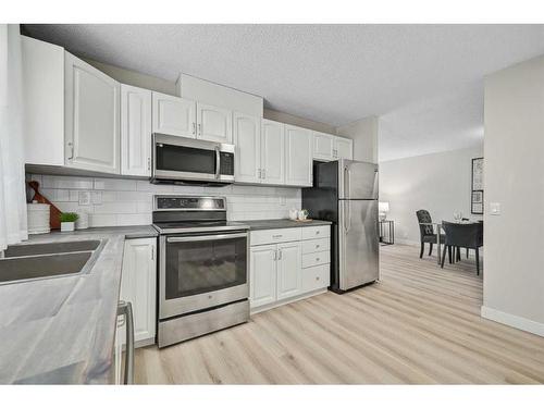 86 Abalone Crescent Ne, Calgary, AB - Indoor Photo Showing Kitchen With Double Sink