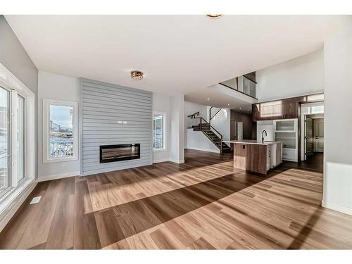 488 Rivercrest View, Cochrane, AB - Indoor Photo Showing Living Room With Fireplace