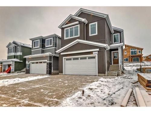 488 Rivercrest View, Cochrane, AB - Outdoor With Facade