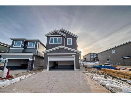 488 Rivercrest View, Cochrane, AB - Outdoor With Facade