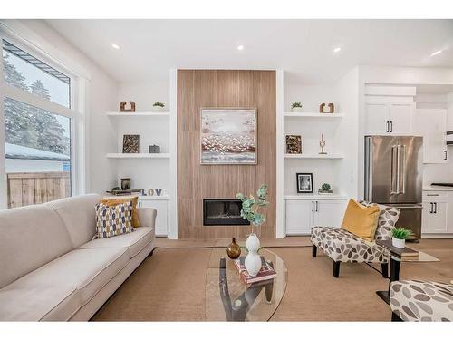 1112B Regent Crescent Ne, Calgary, AB - Indoor Photo Showing Living Room With Fireplace