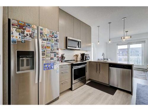 1332-76 Cornerstone Passage Ne, Calgary, AB - Indoor Photo Showing Kitchen With Stainless Steel Kitchen With Upgraded Kitchen