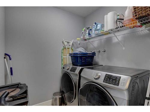 28 Crestbrook Way Sw, Calgary, AB - Indoor Photo Showing Laundry Room