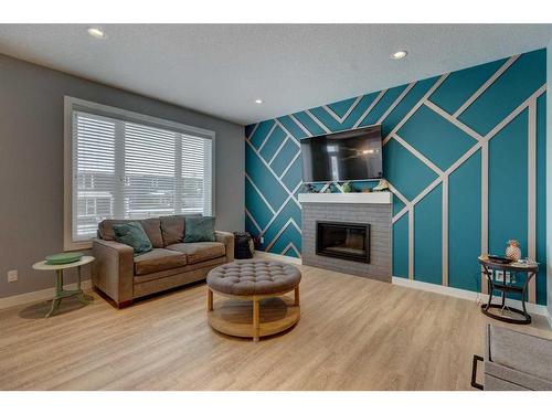 28 Crestbrook Way Sw, Calgary, AB - Indoor Photo Showing Living Room With Fireplace