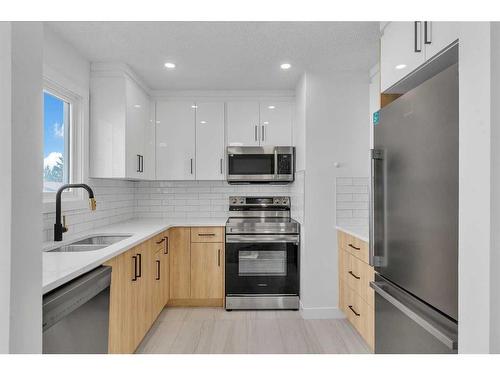 45 Templemont Drive Ne, Calgary, AB - Indoor Photo Showing Kitchen With Stainless Steel Kitchen With Double Sink With Upgraded Kitchen