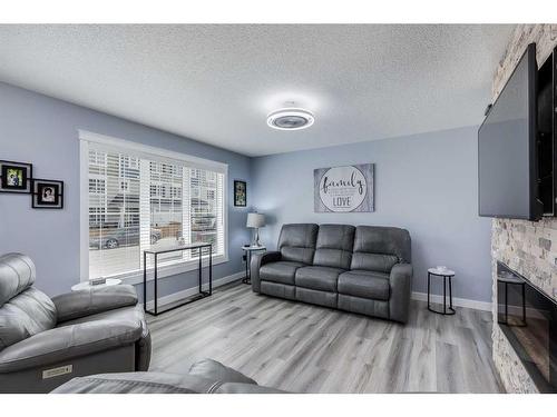 511 Windstone Common Sw, Airdrie, AB - Indoor Photo Showing Living Room With Fireplace