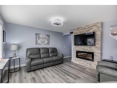 511 Windstone Common Sw, Airdrie, AB - Indoor Photo Showing Living Room With Fireplace