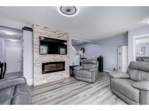 511 Windstone Common Sw, Airdrie, AB - Indoor Photo Showing Living Room With Fireplace