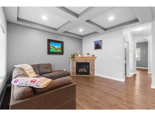 929 Channelside Road Sw, Airdrie, AB - Indoor Photo Showing Living Room With Fireplace