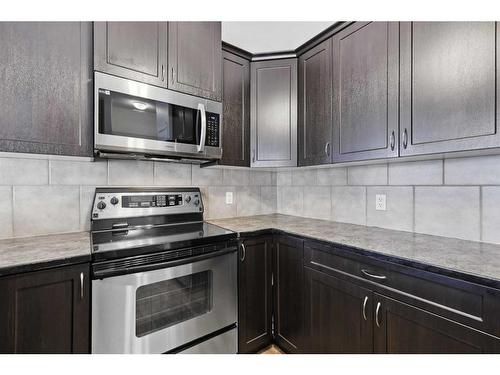 56 Arbours Circle Nw, Langdon, AB - Indoor Photo Showing Kitchen