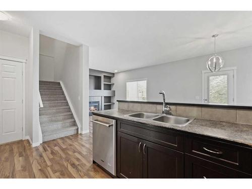 56 Arbours Circle Nw, Langdon, AB - Indoor Photo Showing Kitchen With Double Sink