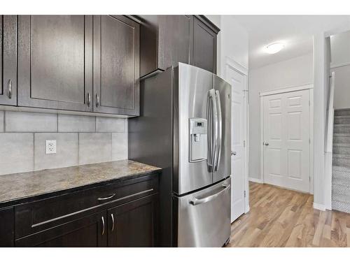 56 Arbours Circle Nw, Langdon, AB - Indoor Photo Showing Kitchen