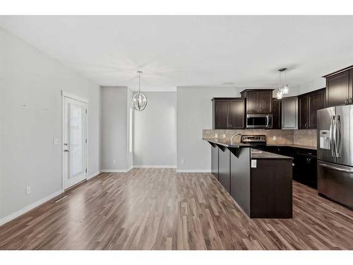 56 Arbours Circle Nw, Langdon, AB - Indoor Photo Showing Kitchen With Stainless Steel Kitchen