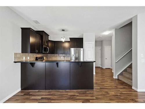 56 Arbours Circle Nw, Langdon, AB - Indoor Photo Showing Kitchen With Upgraded Kitchen