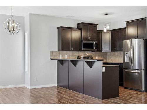 56 Arbours Circle Nw, Langdon, AB - Indoor Photo Showing Kitchen With Stainless Steel Kitchen With Upgraded Kitchen