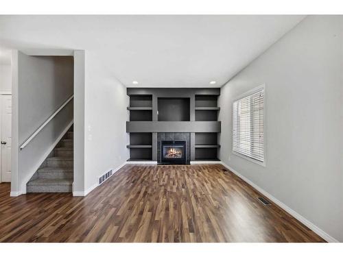 56 Arbours Circle Nw, Langdon, AB - Indoor With Fireplace