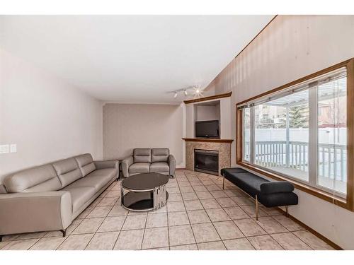 26 Arbour Butte Road Nw, Calgary, AB - Indoor Photo Showing Other Room With Fireplace