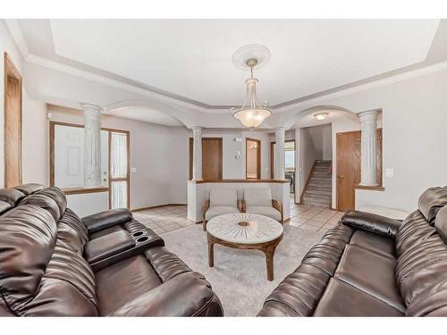 26 Arbour Butte Road Nw, Calgary, AB - Indoor Photo Showing Living Room