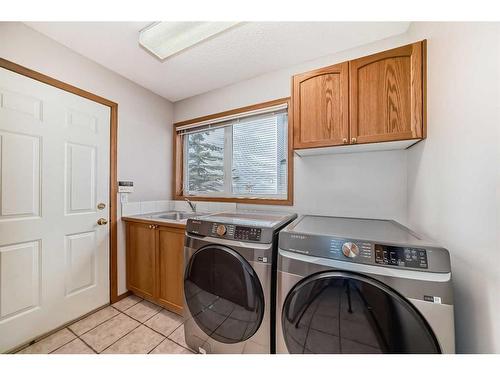 26 Arbour Butte Road Nw, Calgary, AB - Indoor Photo Showing Laundry Room