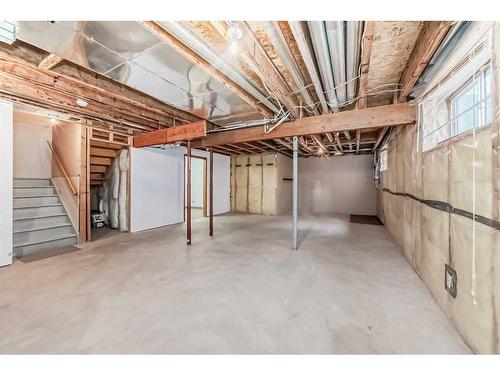 26 Arbour Butte Road Nw, Calgary, AB - Indoor Photo Showing Basement