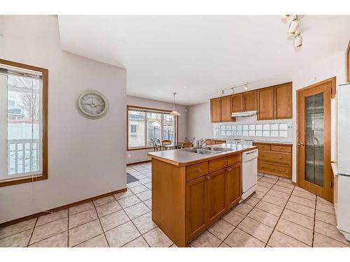 26 Arbour Butte Road Nw, Calgary, AB - Indoor Photo Showing Kitchen With Double Sink