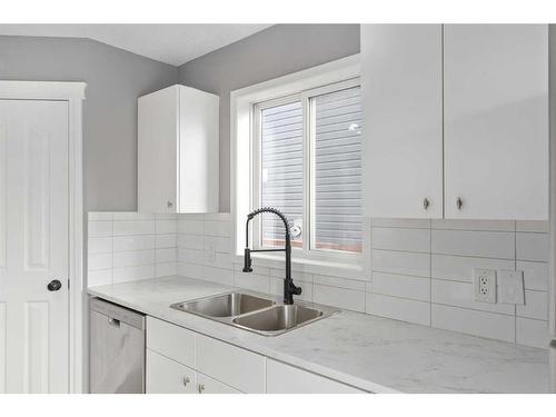 144 Chaparral Ridge Circle Se, Calgary, AB - Indoor Photo Showing Kitchen With Double Sink