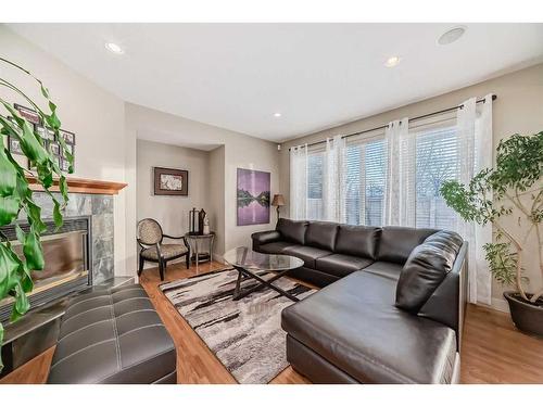 96 Evergreen Square Sw, Calgary, AB - Indoor Photo Showing Living Room With Fireplace