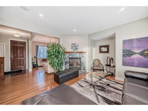 96 Evergreen Square Sw, Calgary, AB - Indoor Photo Showing Living Room With Fireplace