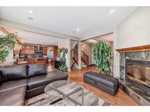 96 Evergreen Square Sw, Calgary, AB - Indoor Photo Showing Living Room With Fireplace