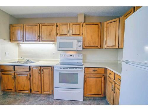 1290 Ranchlands Road Nw, Calgary, AB - Indoor Photo Showing Kitchen