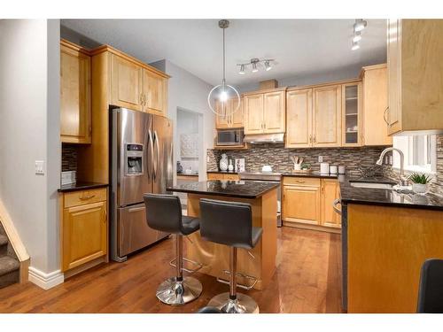 38-39 Strathlea Common Sw, Calgary, AB - Indoor Photo Showing Kitchen With Stainless Steel Kitchen With Upgraded Kitchen