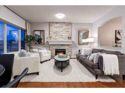 38-39 Strathlea Common Sw, Calgary, AB - Indoor Photo Showing Living Room With Fireplace